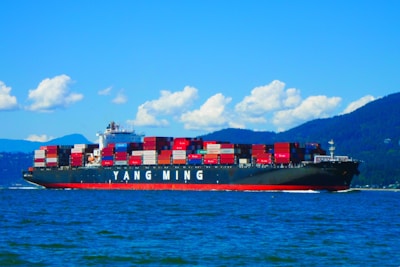 A large cargo ship sailing across a large body of water