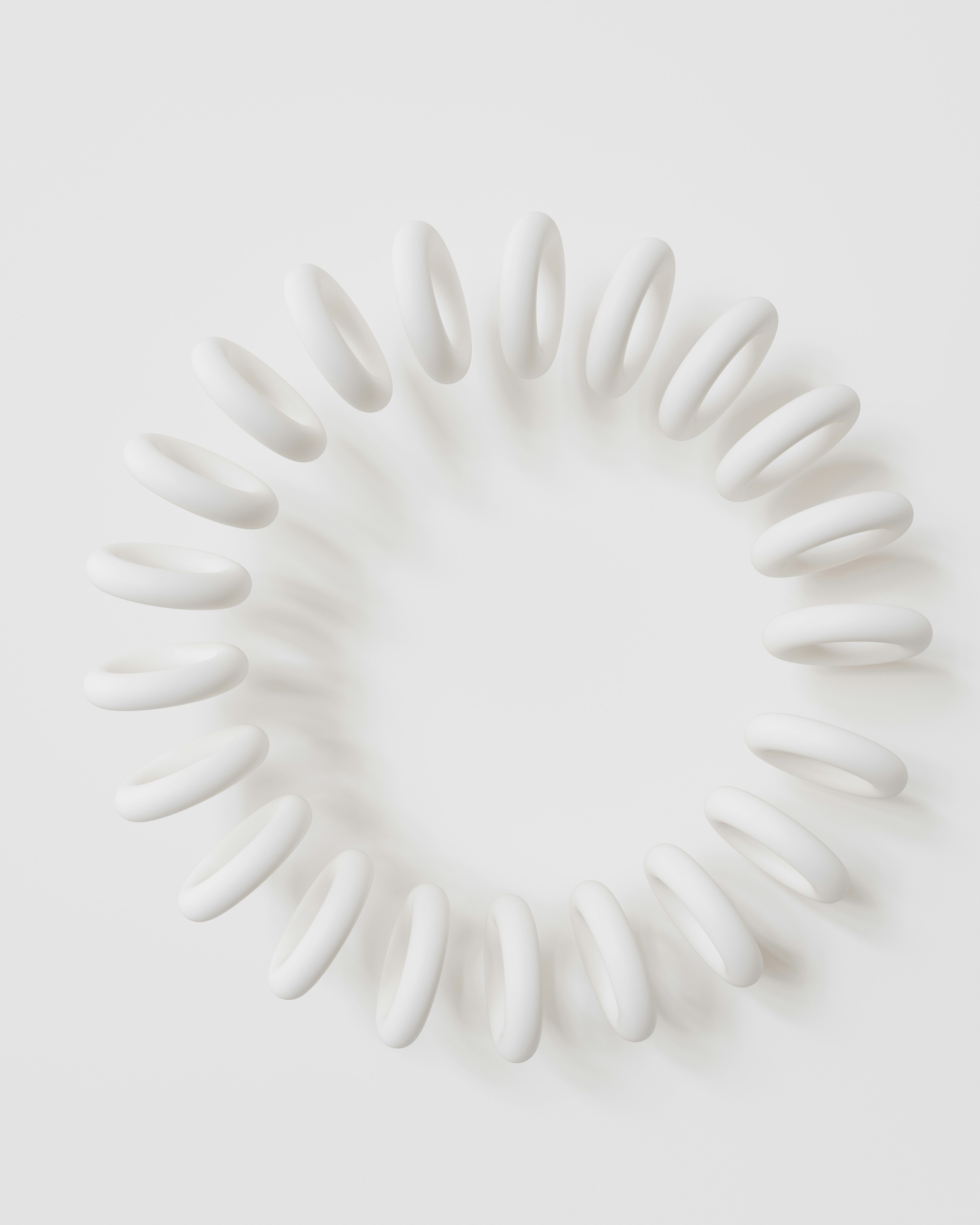 A white circular object on a white surface