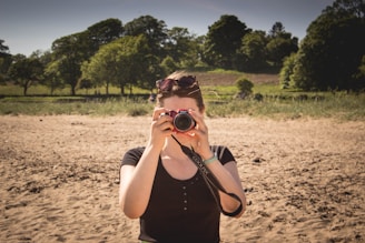 A woman taking a picture of herself with a camera