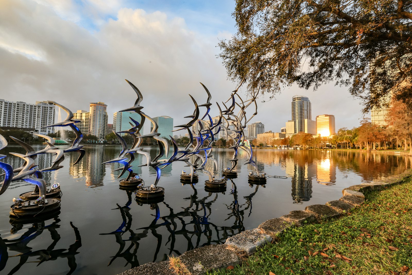 Downtown Orlando skyline reflected in Lake Eola at sunrise