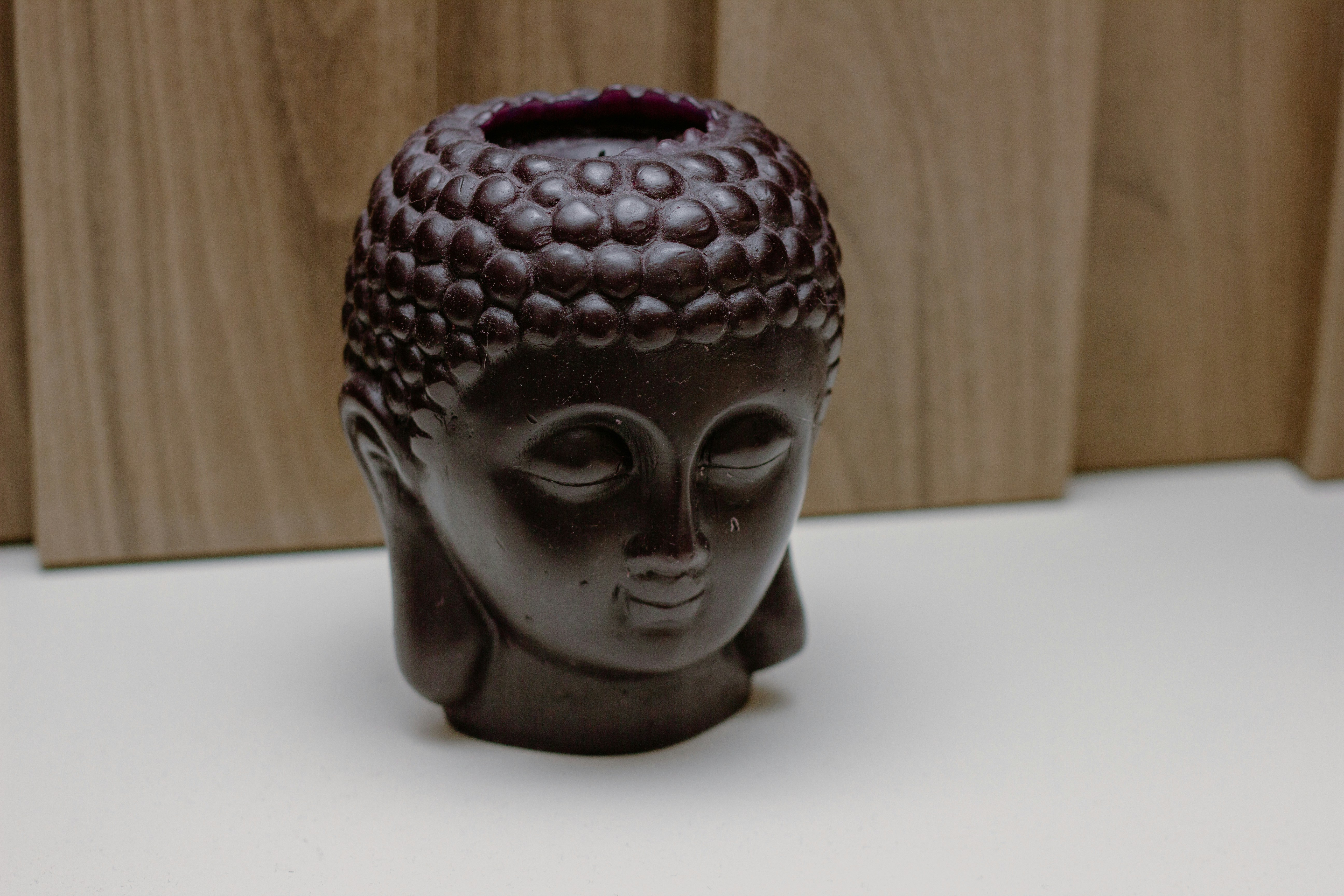 Ceramic buddha head on table