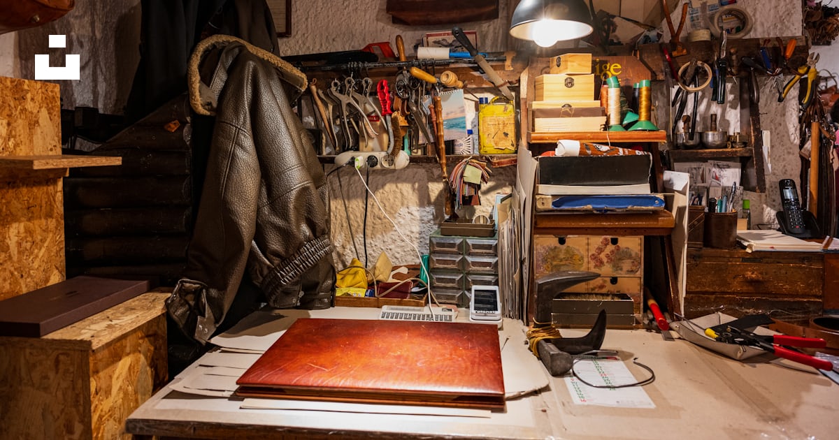 A room filled with lots of clutter and hanging lights photo – Free ...