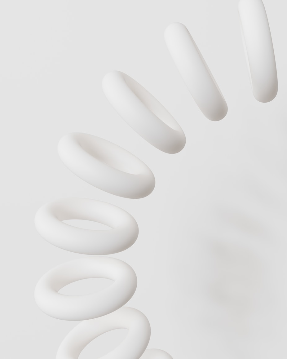 A group of white spirals on a white background
