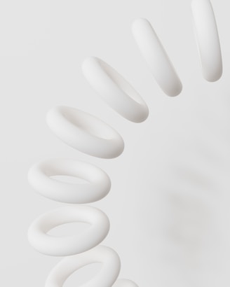 A group of white spirals on a white background