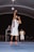 A man in a white uniform is playing basketball