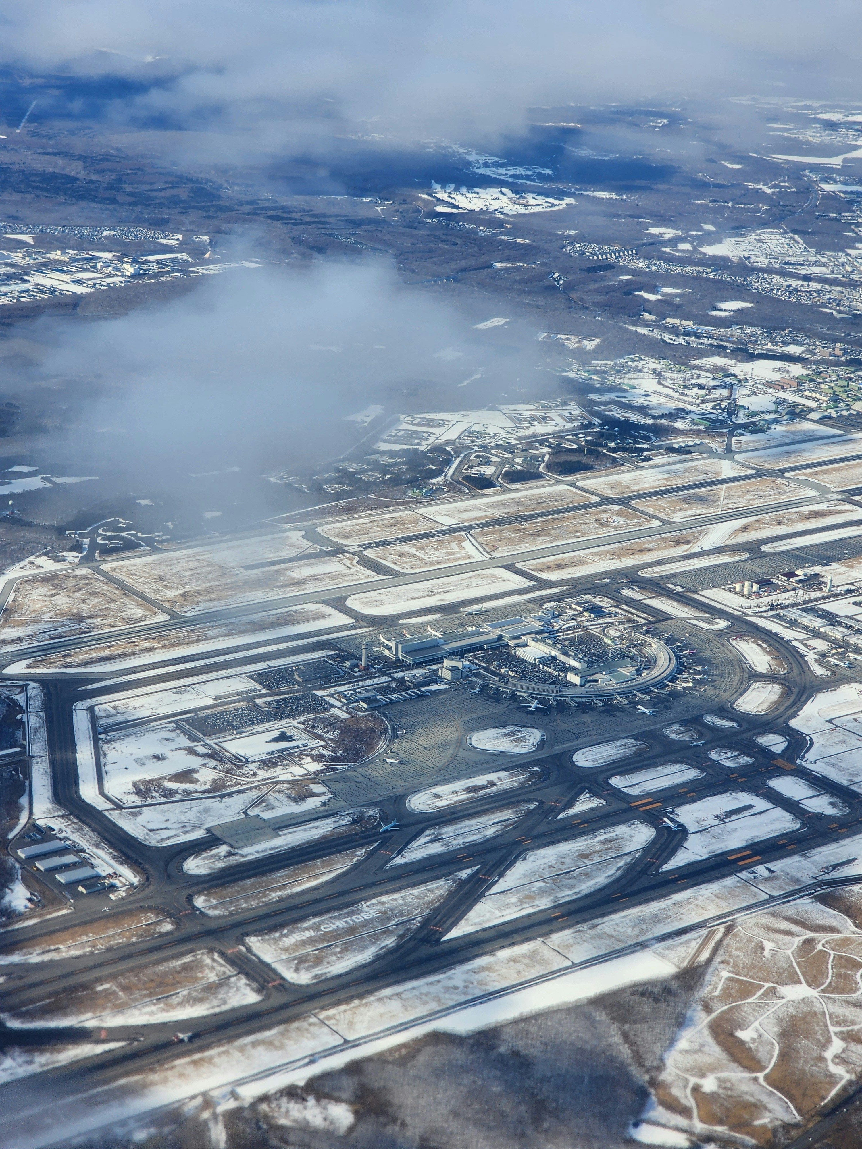 New Chitose Airport from the air, its runways cleared through snow