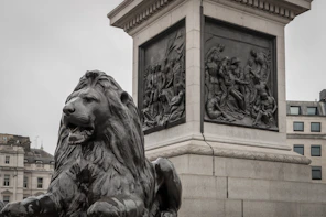 A statue of a lion in front of a building