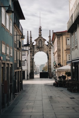 A narrow city street lined with tall buildings
