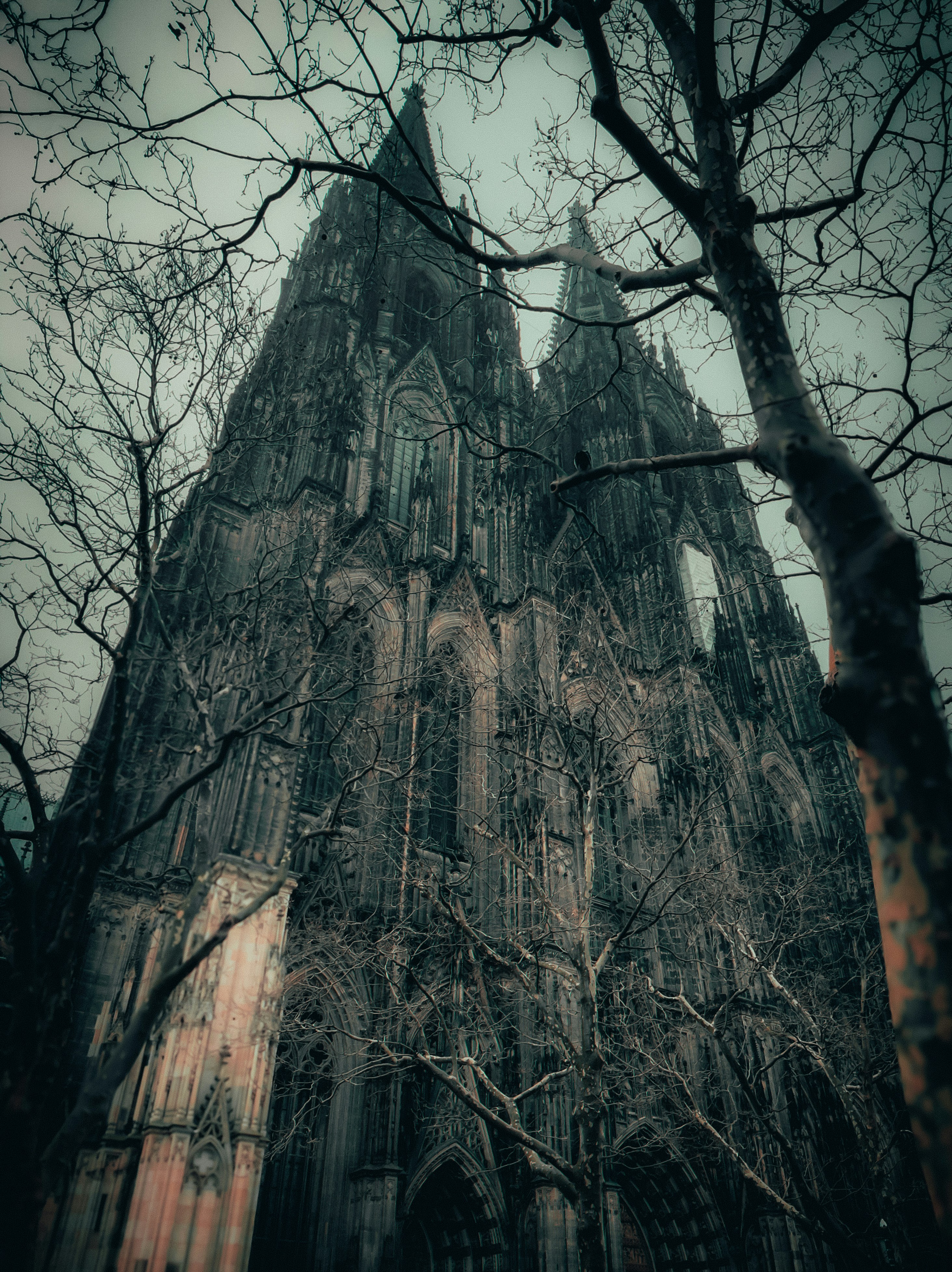 A very tall building with a clock on it's side