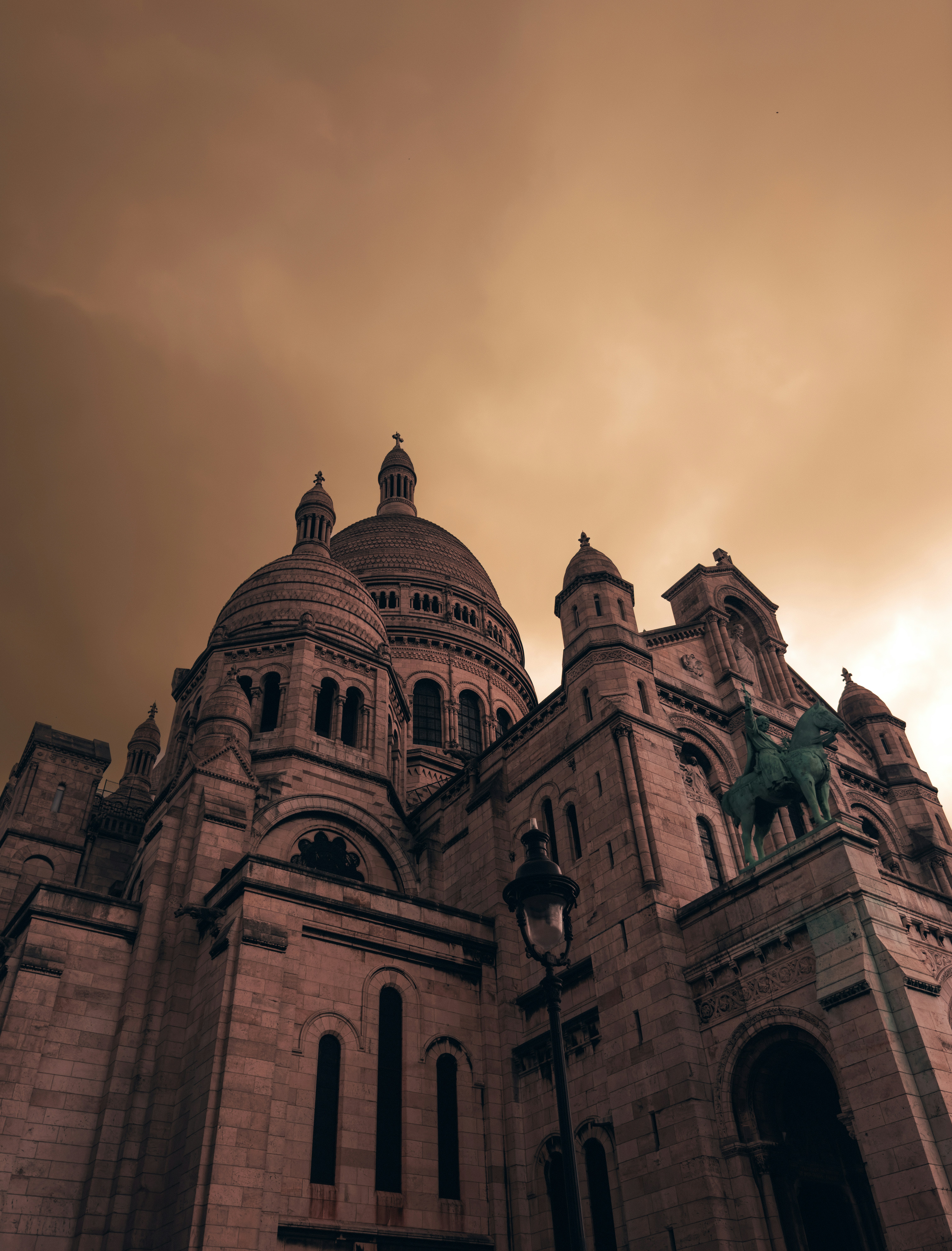 A large building with a statue on top of it