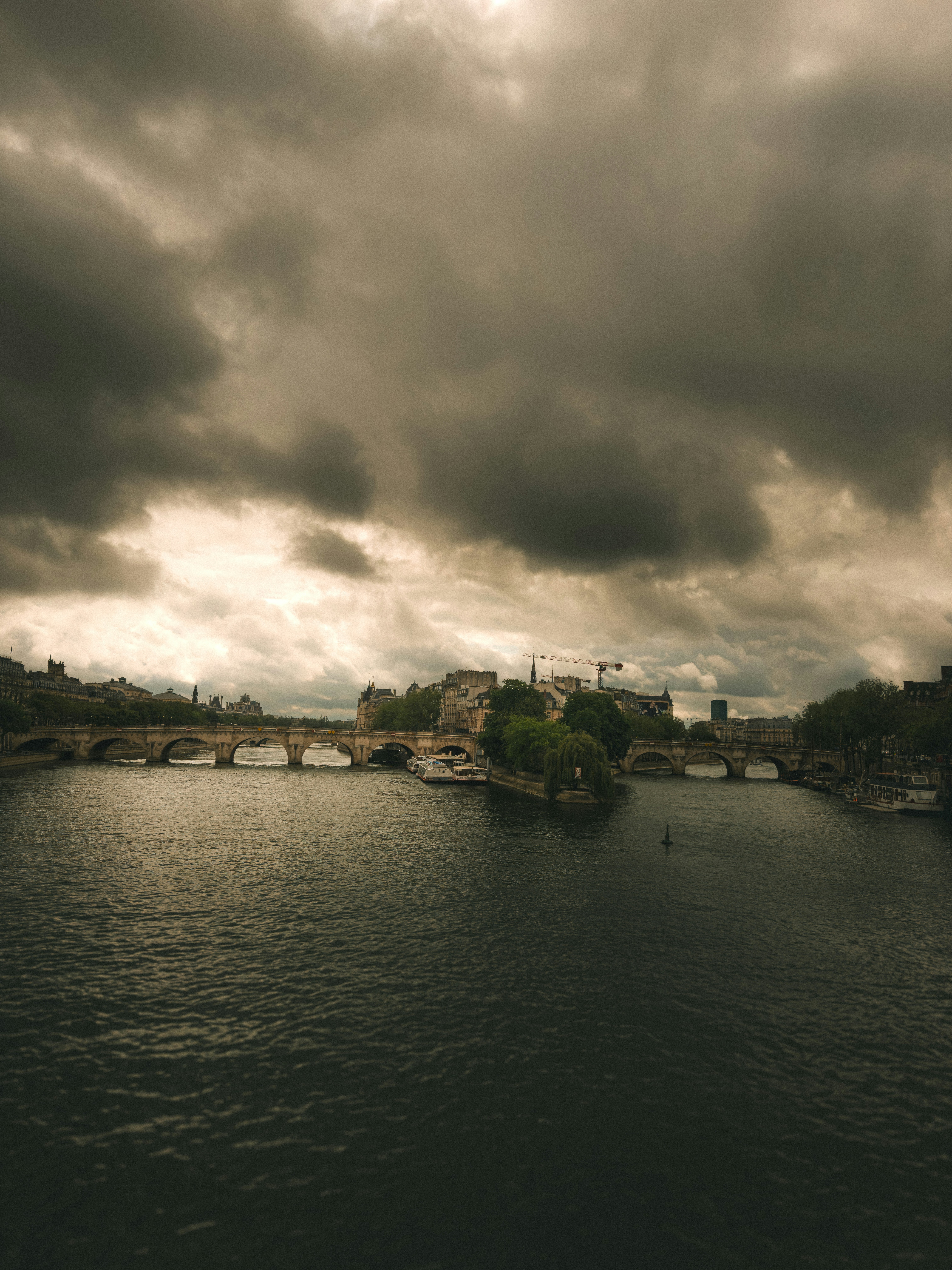 A view of a river with a bridge in the distance