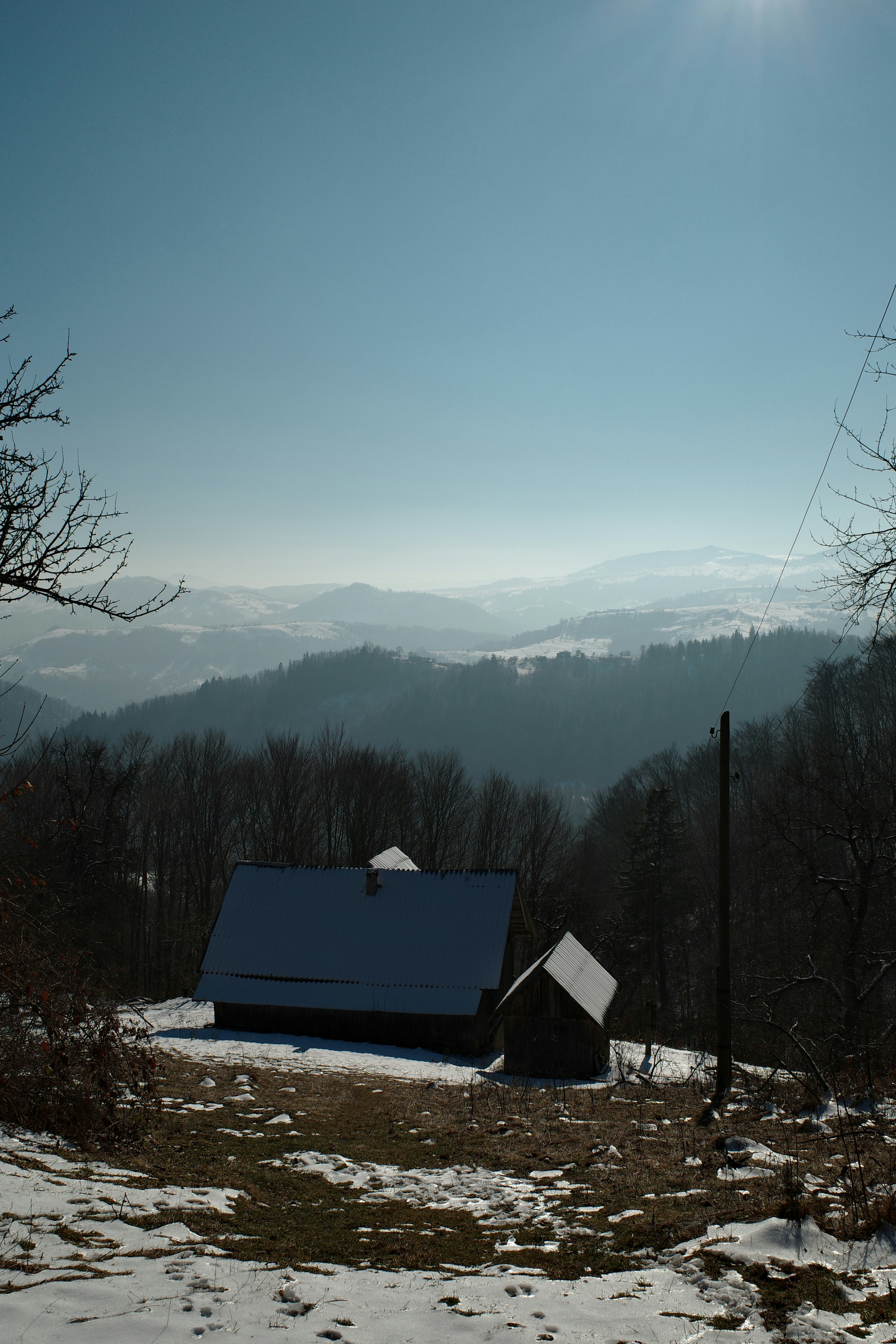 A house in the middle of a snowy field