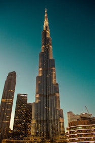 A very tall building towering over a city
