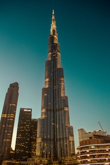A very tall building towering over a city