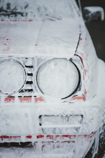 A car is covered in snow and ice