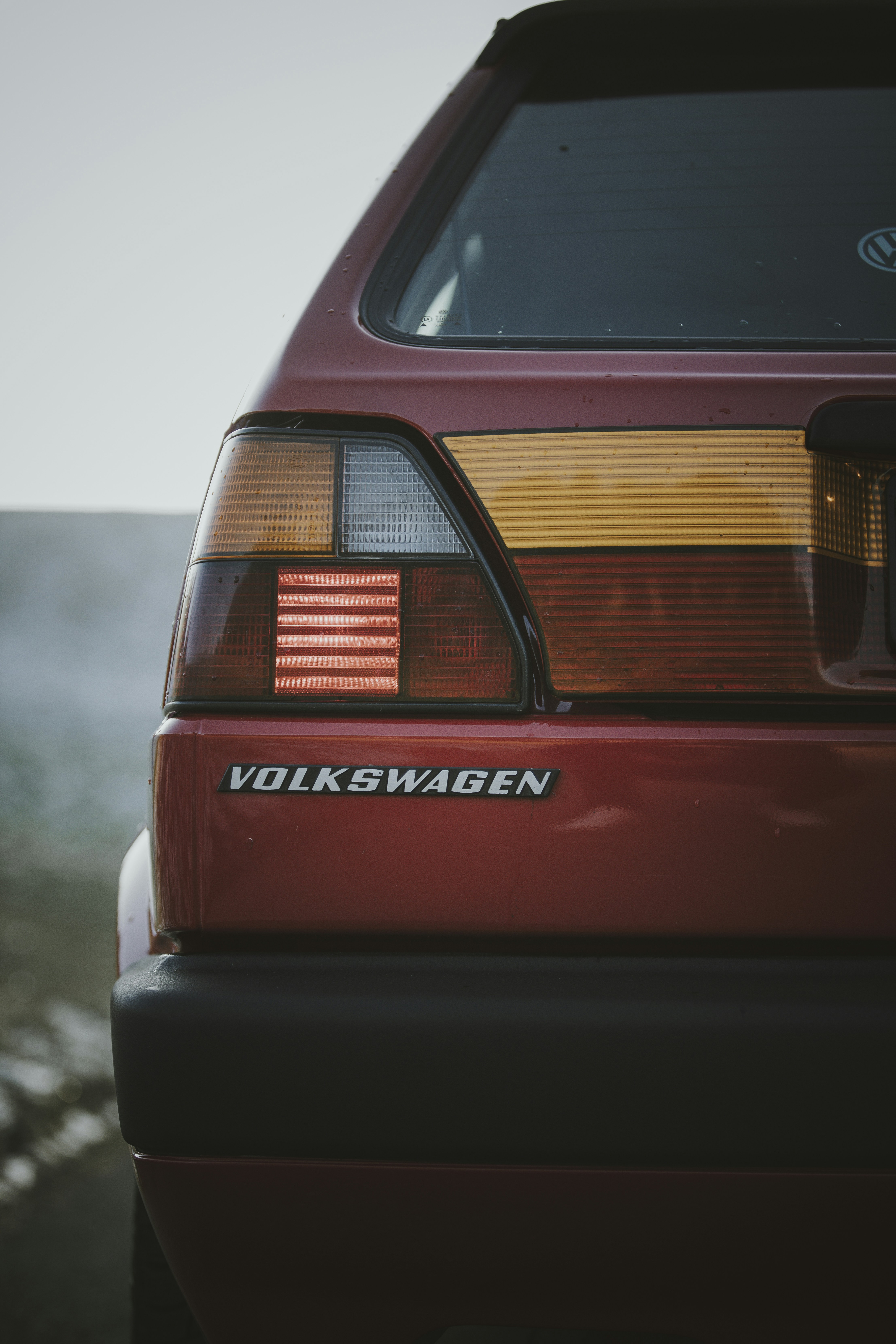 A red car parked in a parking lot