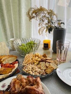 A table filled with plates and bowls of food