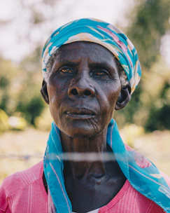 A woman with a blue scarf around her neck