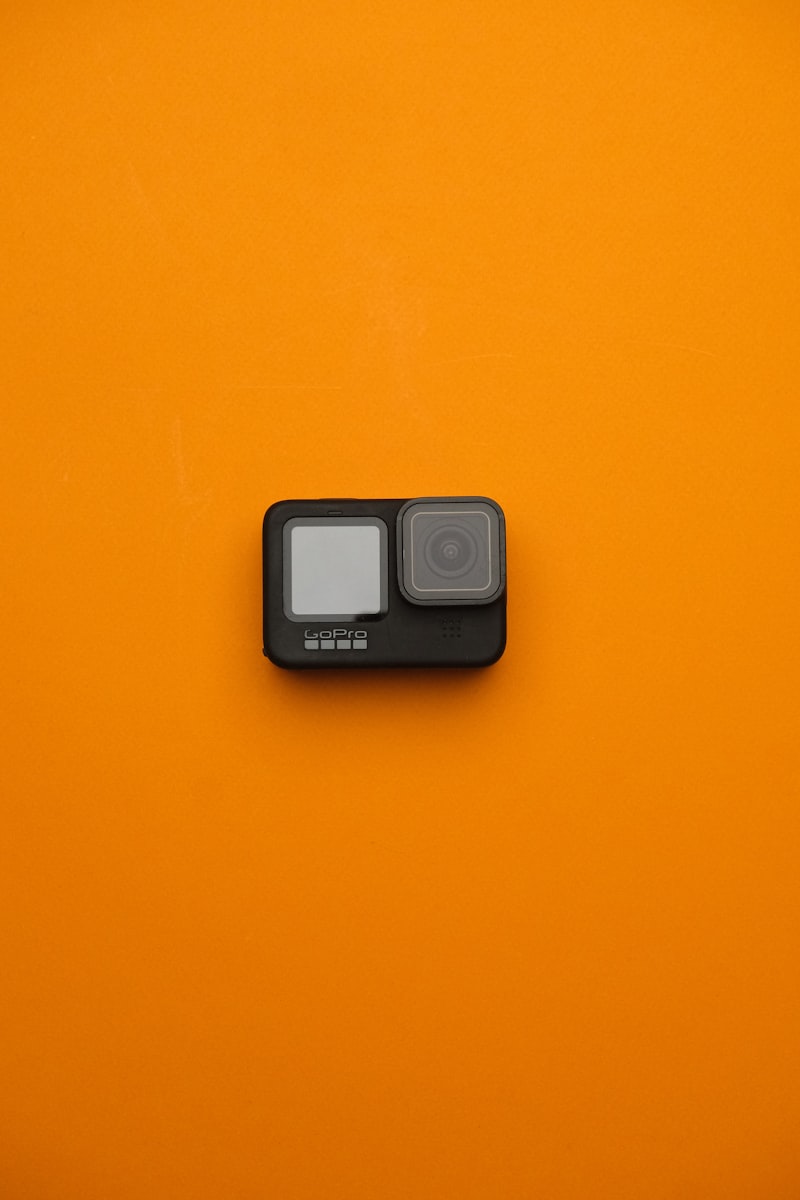 GoPro action camera on an orange background