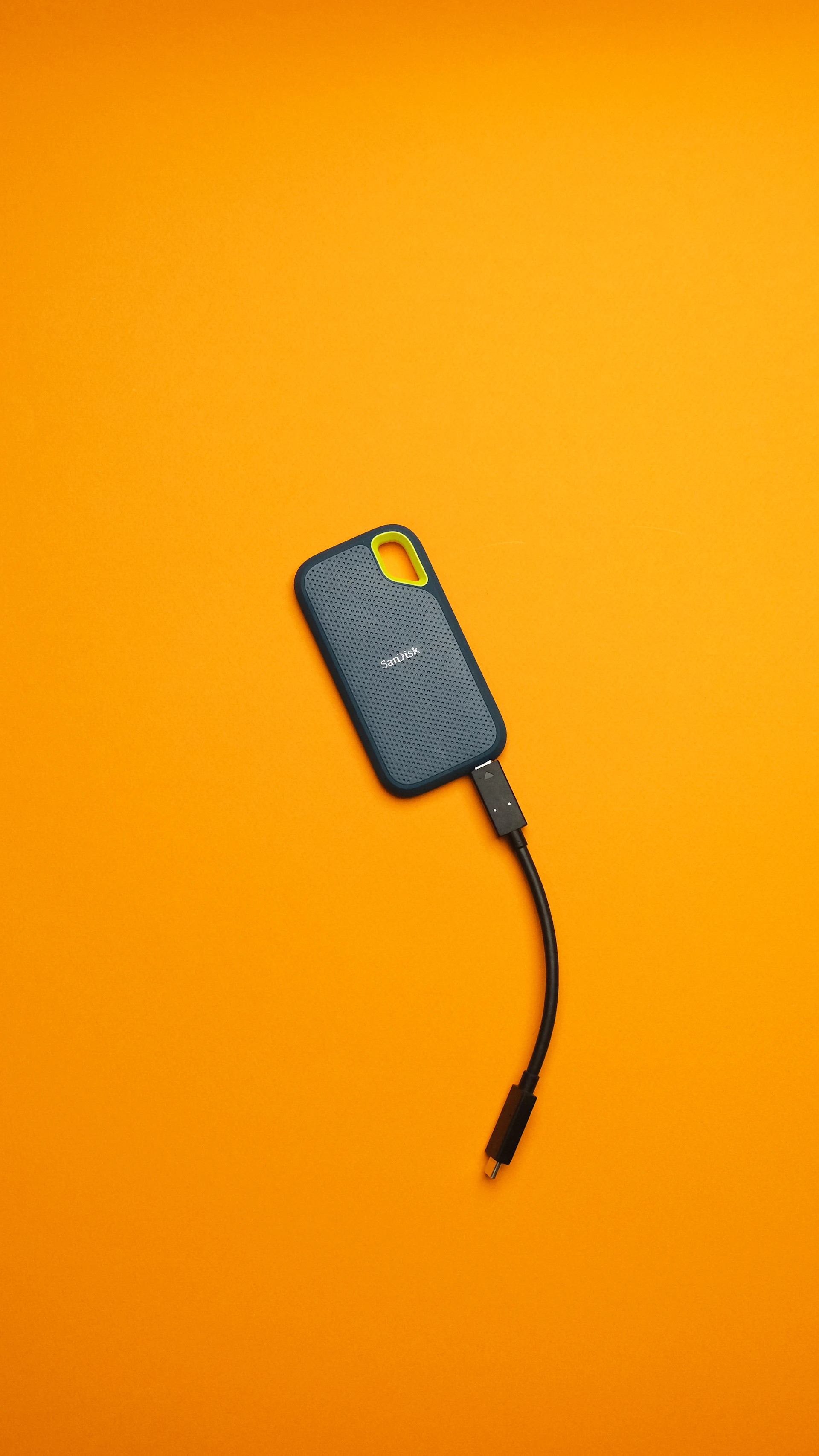 A cell phone hooked up to a cord