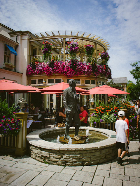 A group of people standing around a fountain