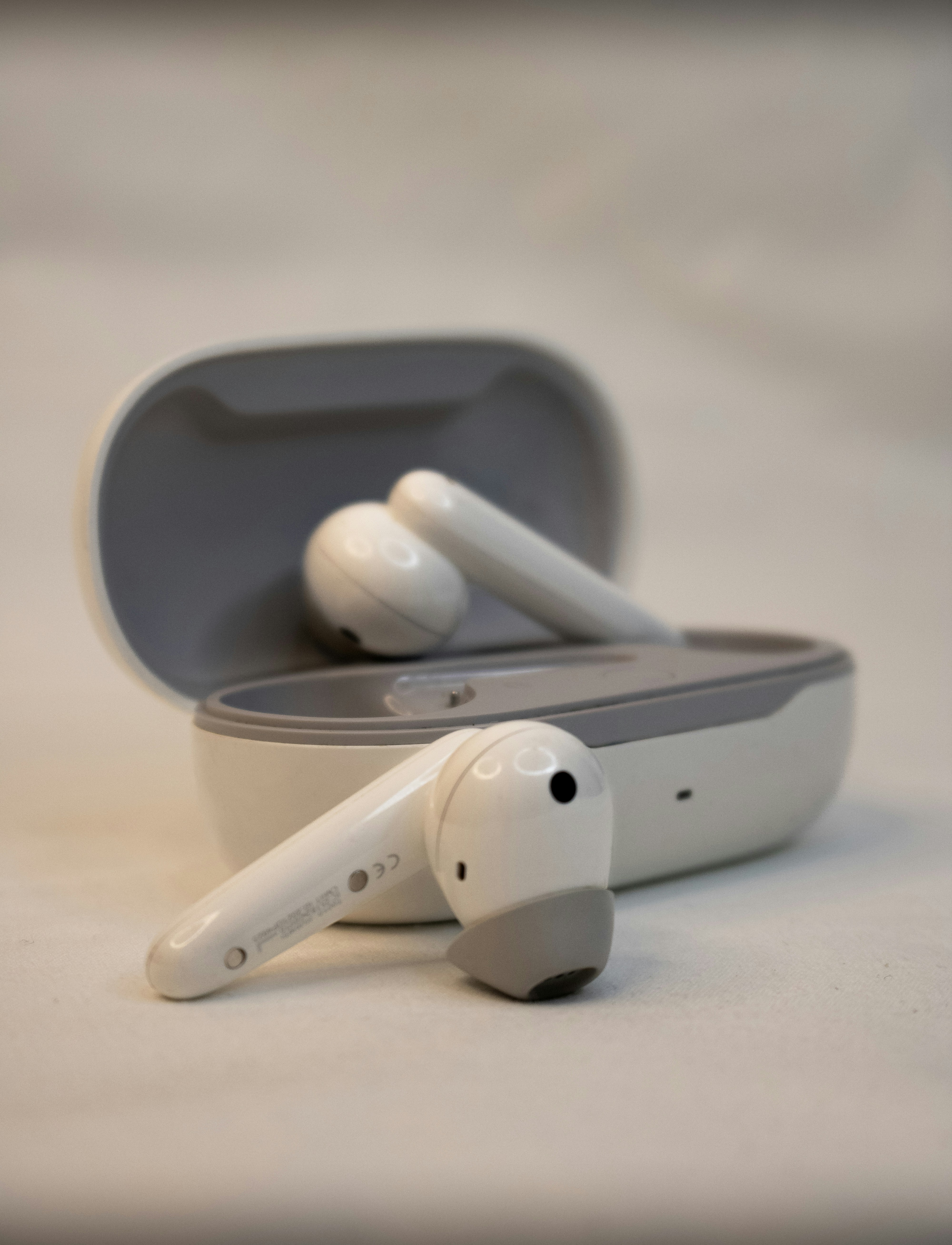 A pair of ear buds sitting in a case