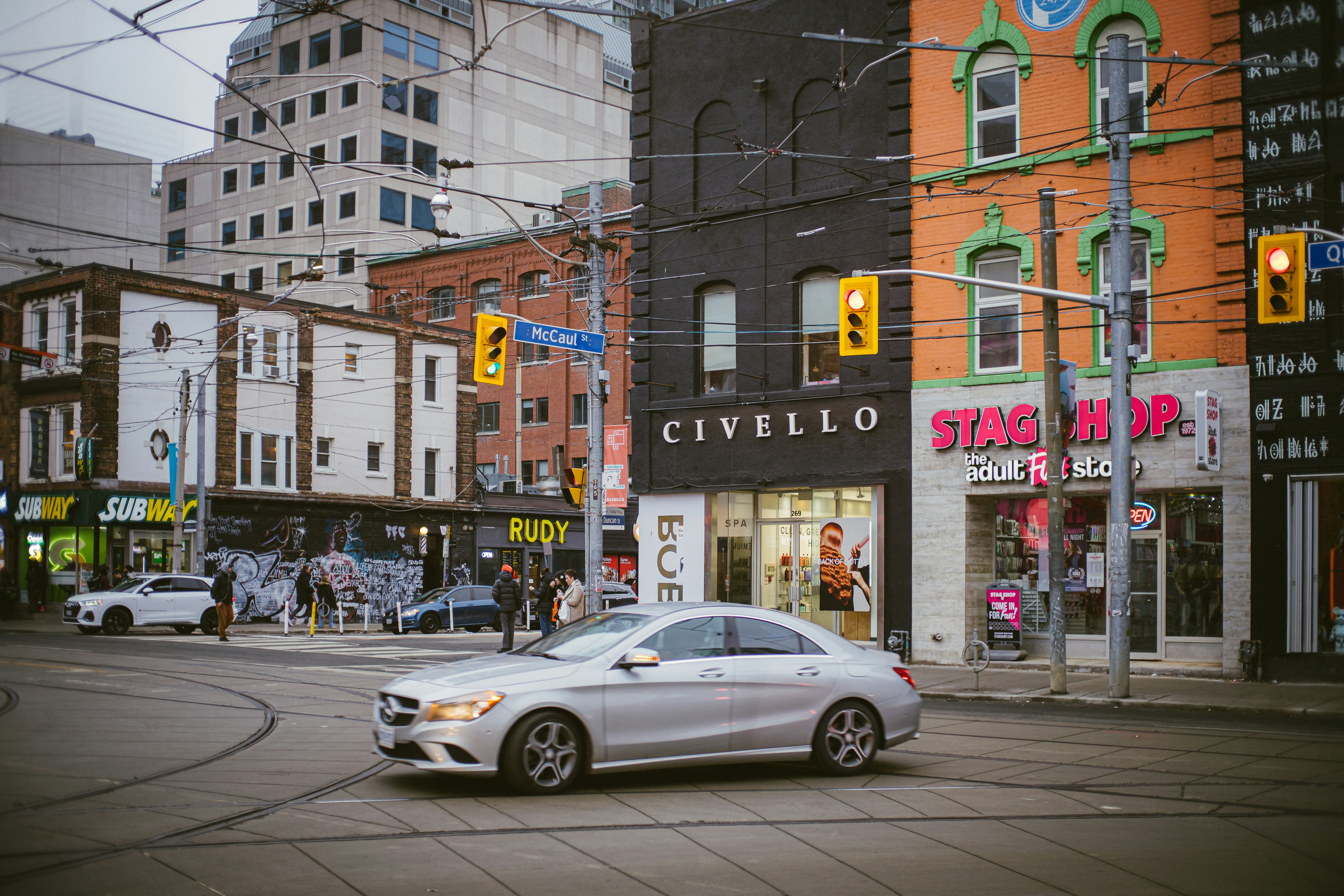 First generation Toyota Prius hybrid driving on a city street