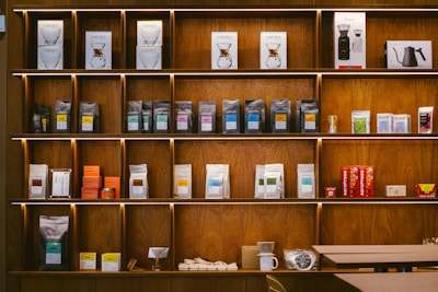 A shelf filled with lots of different types of items