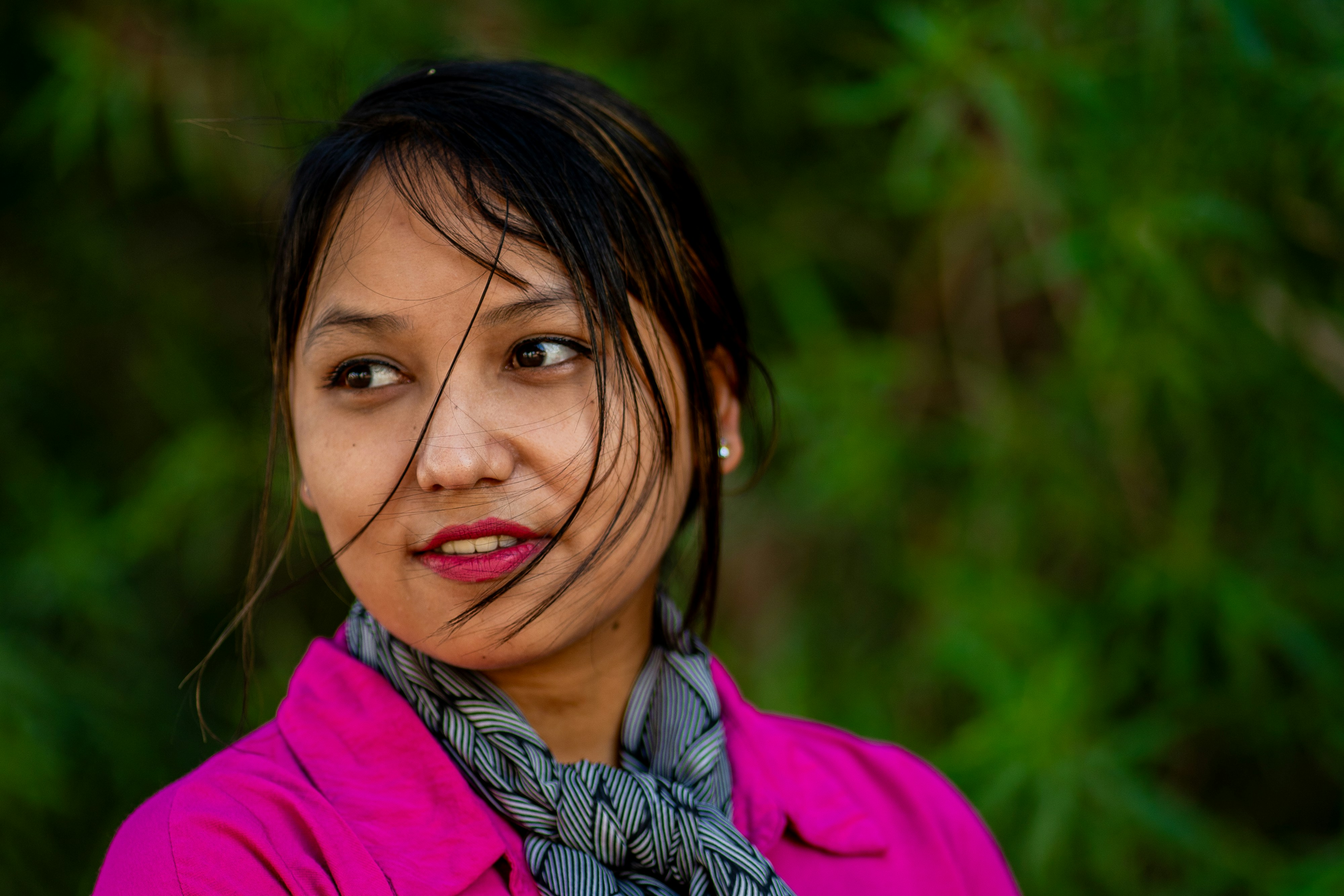 A woman with a scarf around her neck