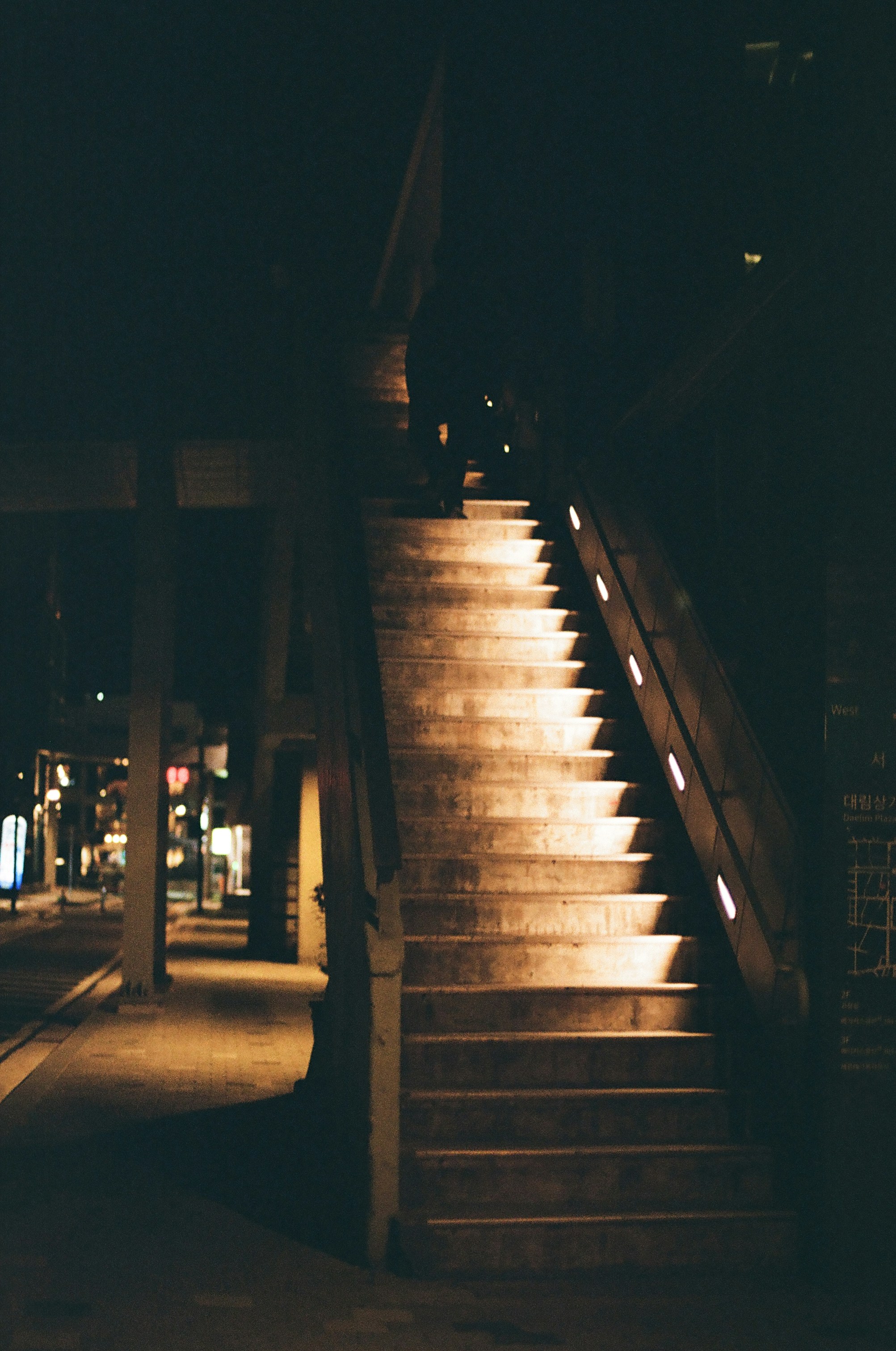 A set of stairs lit up at night