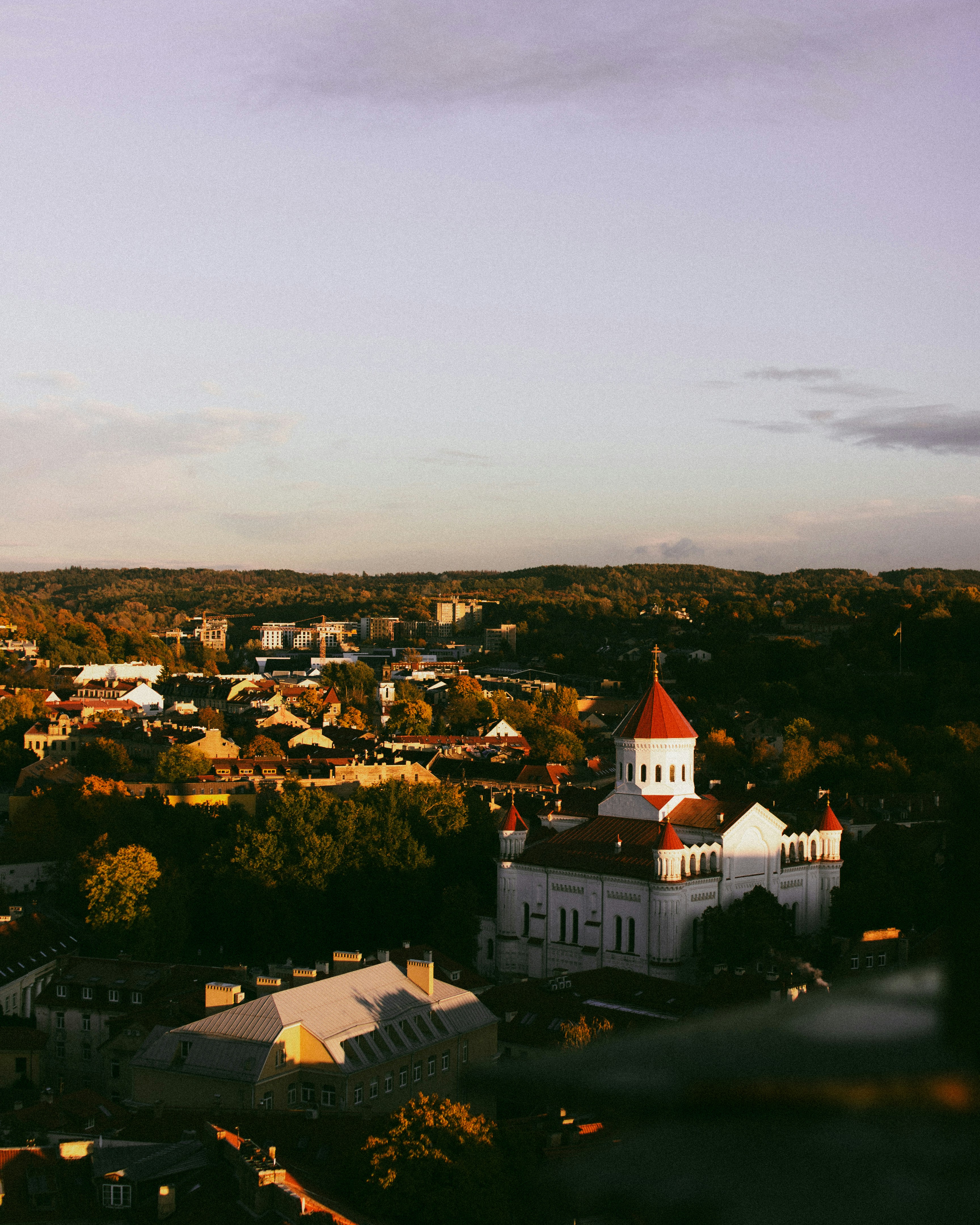 An aerial view of a small town with a clock tower