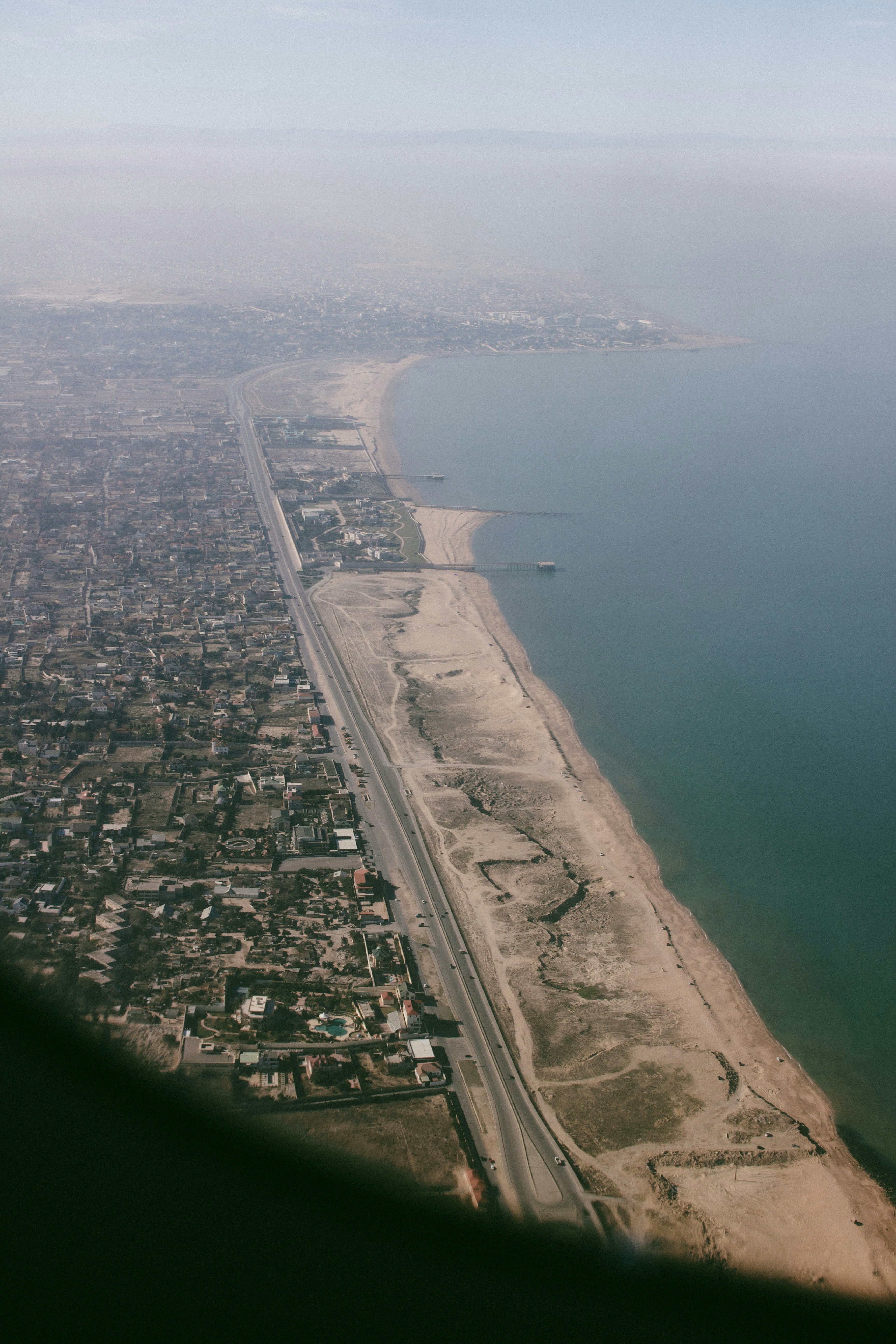 A view of a beach from an airplane