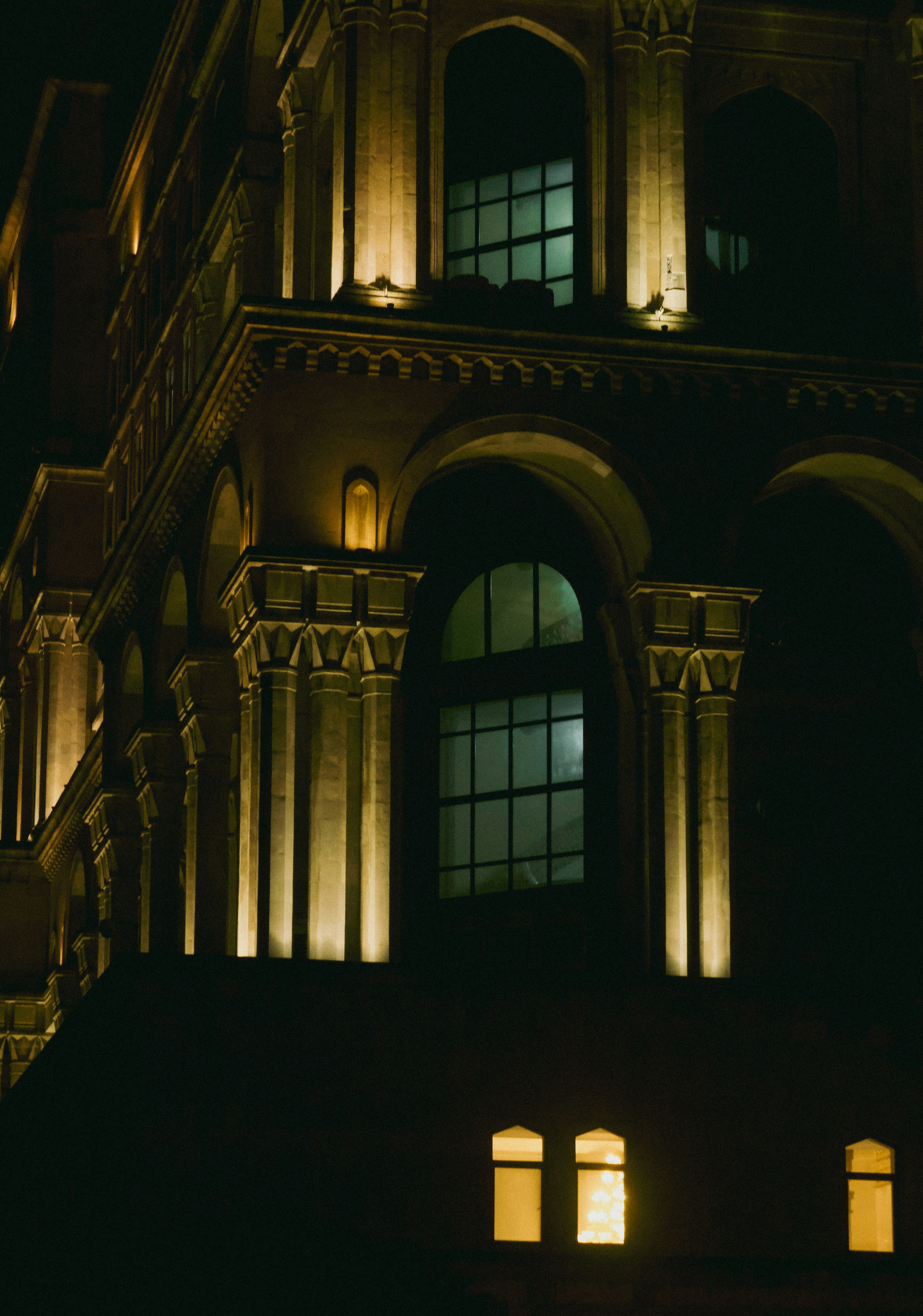 A building lit up at night with windows