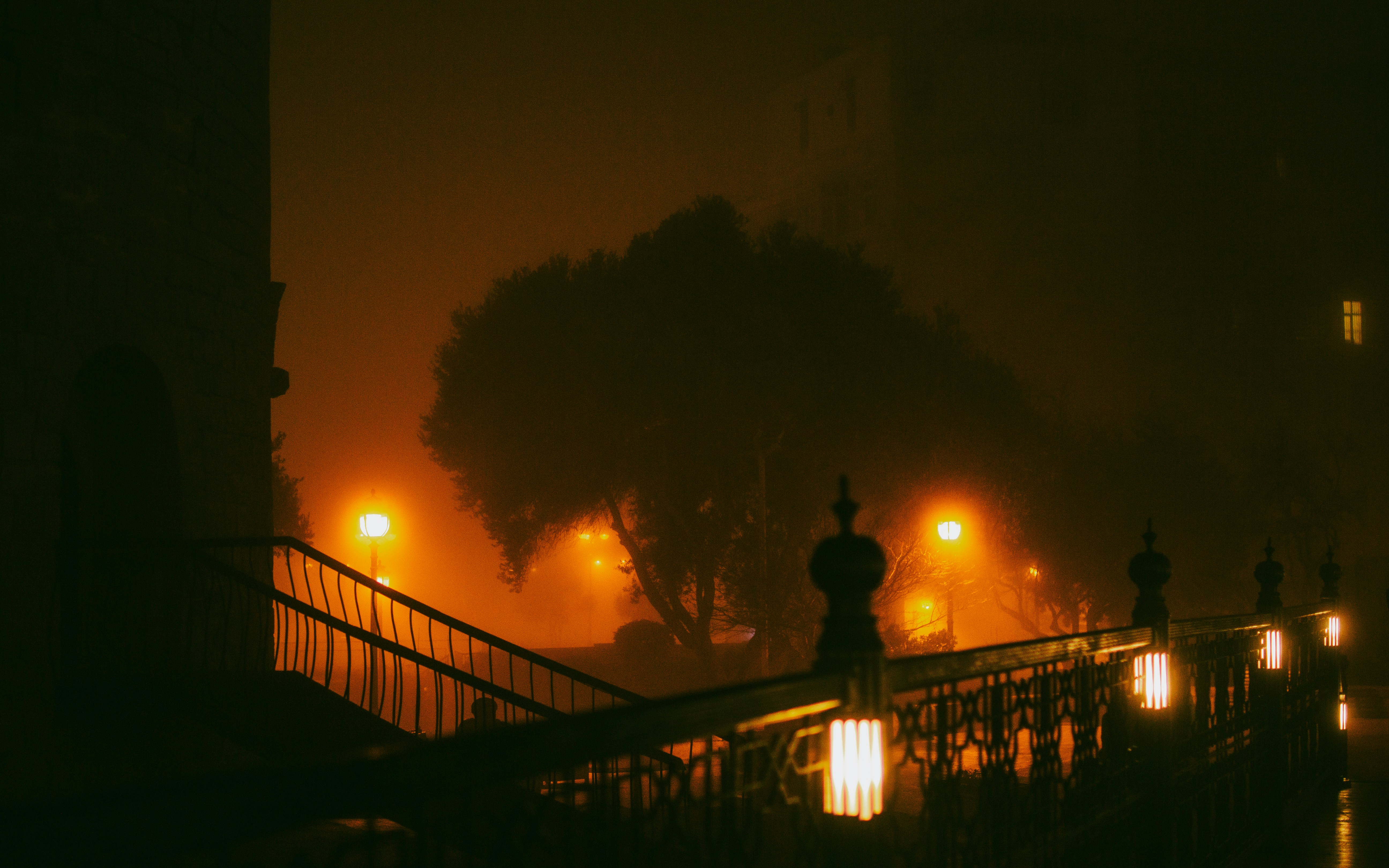 A foggy night in a city with street lights photo – Free Photography ...