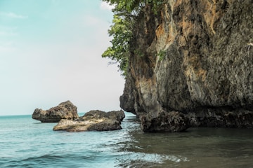 A large rock outcropping into the ocean