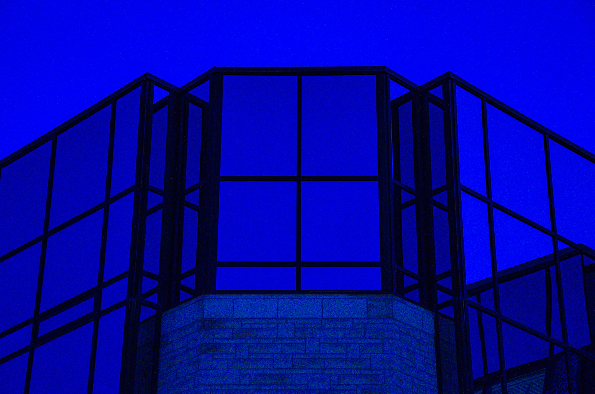 A clock tower with a blue sky in the background