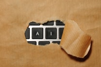 A piece of cardboard with a keyboard appearing through it