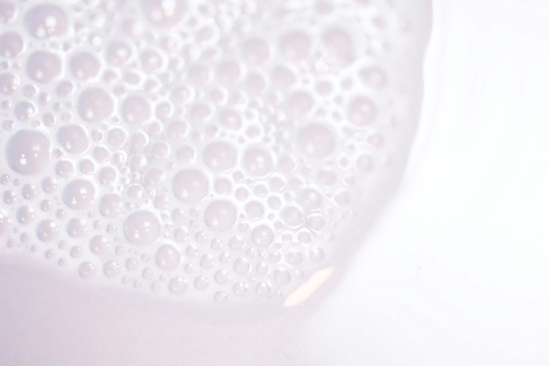 A close up of a white object with bubbles