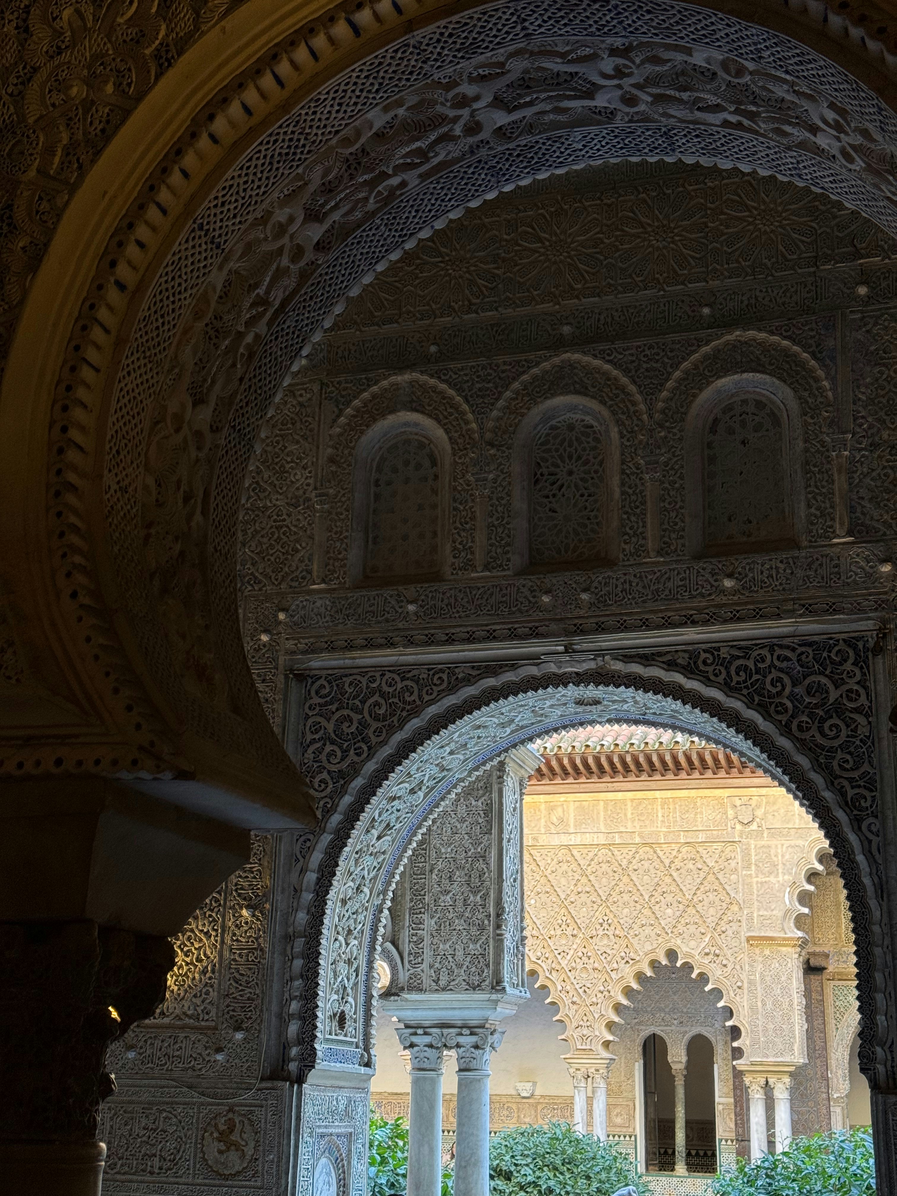 An archway in a building with a clock on the wall