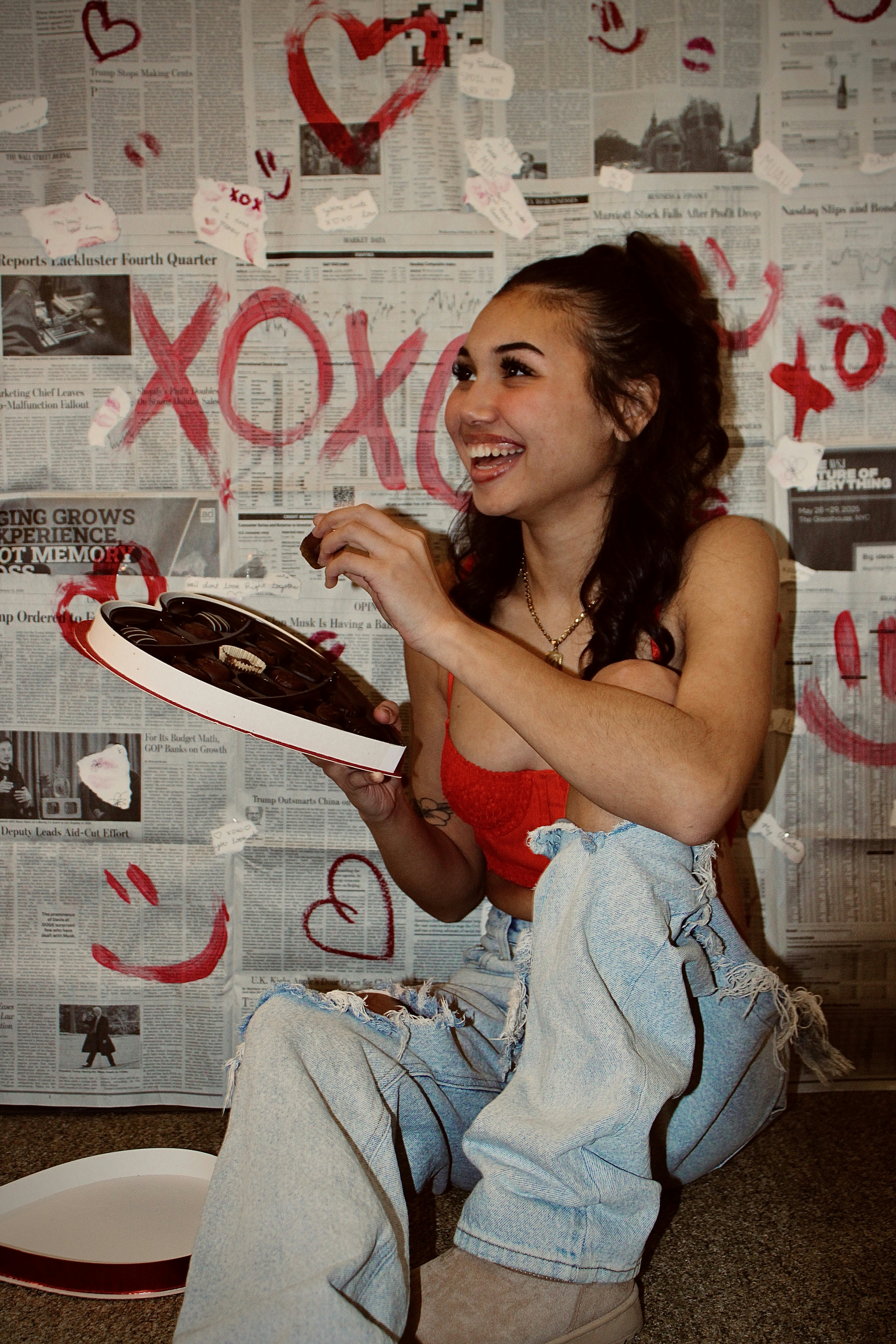 A woman sitting on the floor with a cake