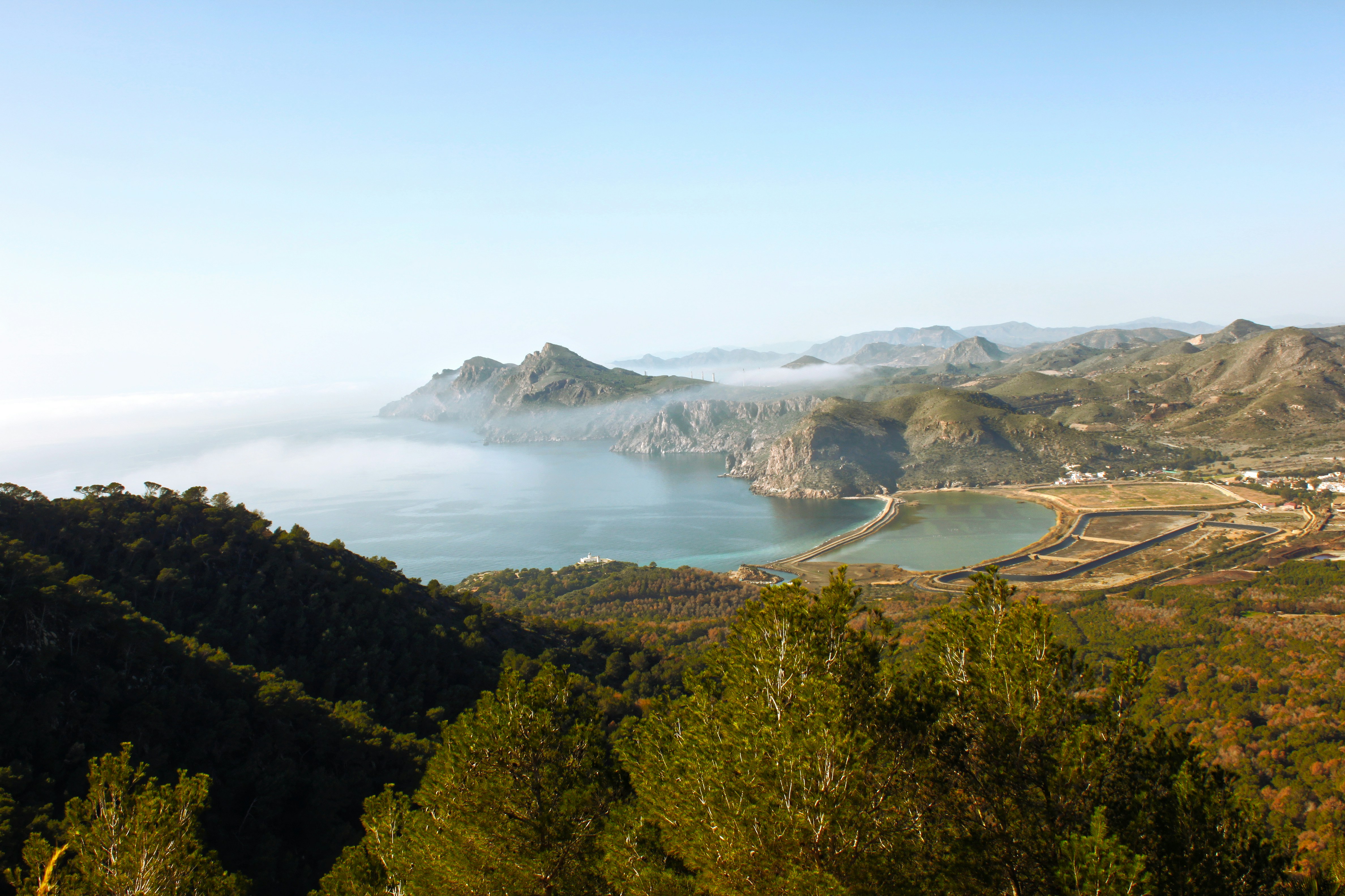 A scenic view of a lake surrounded by mountains
