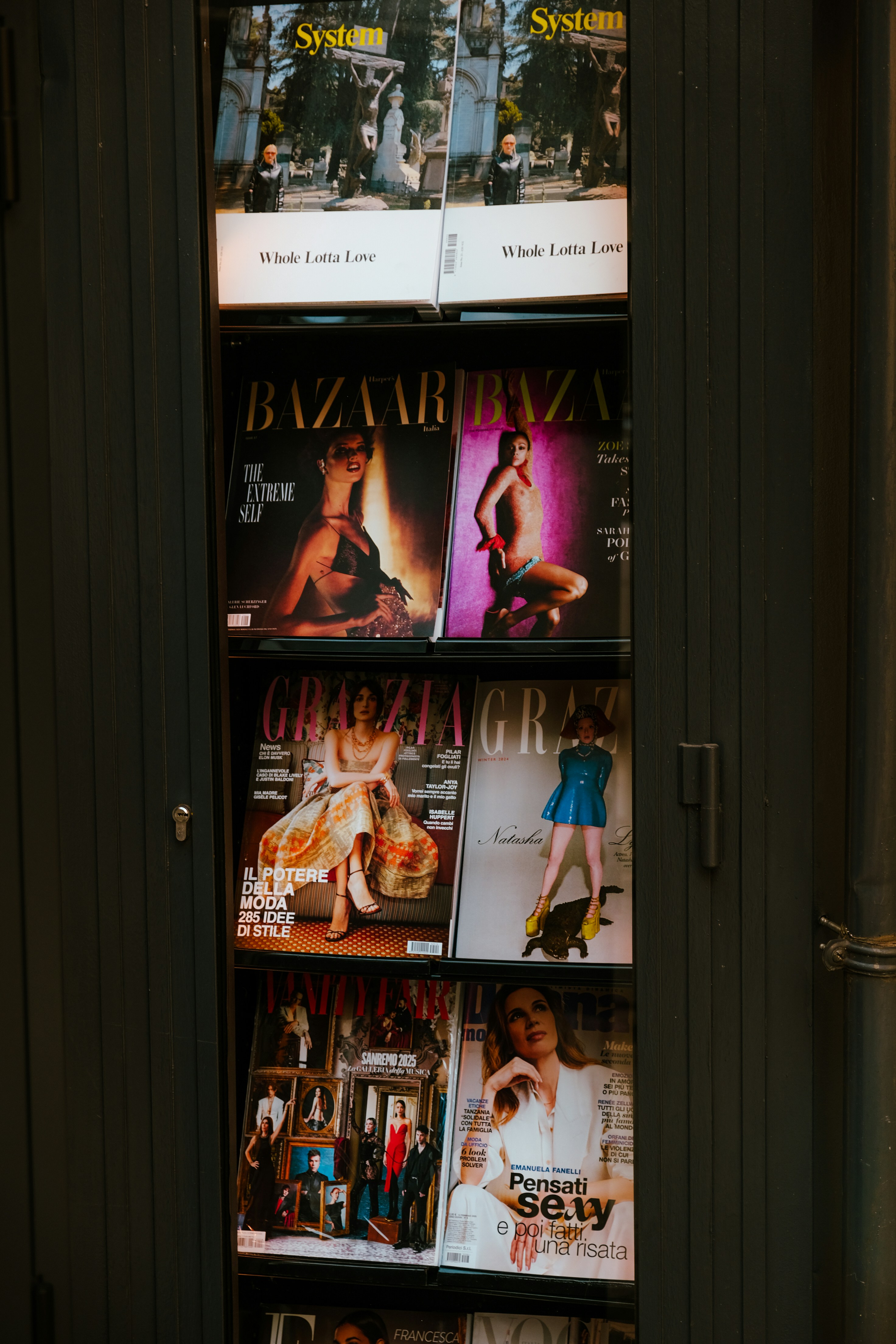 A magazine rack with magazines on it