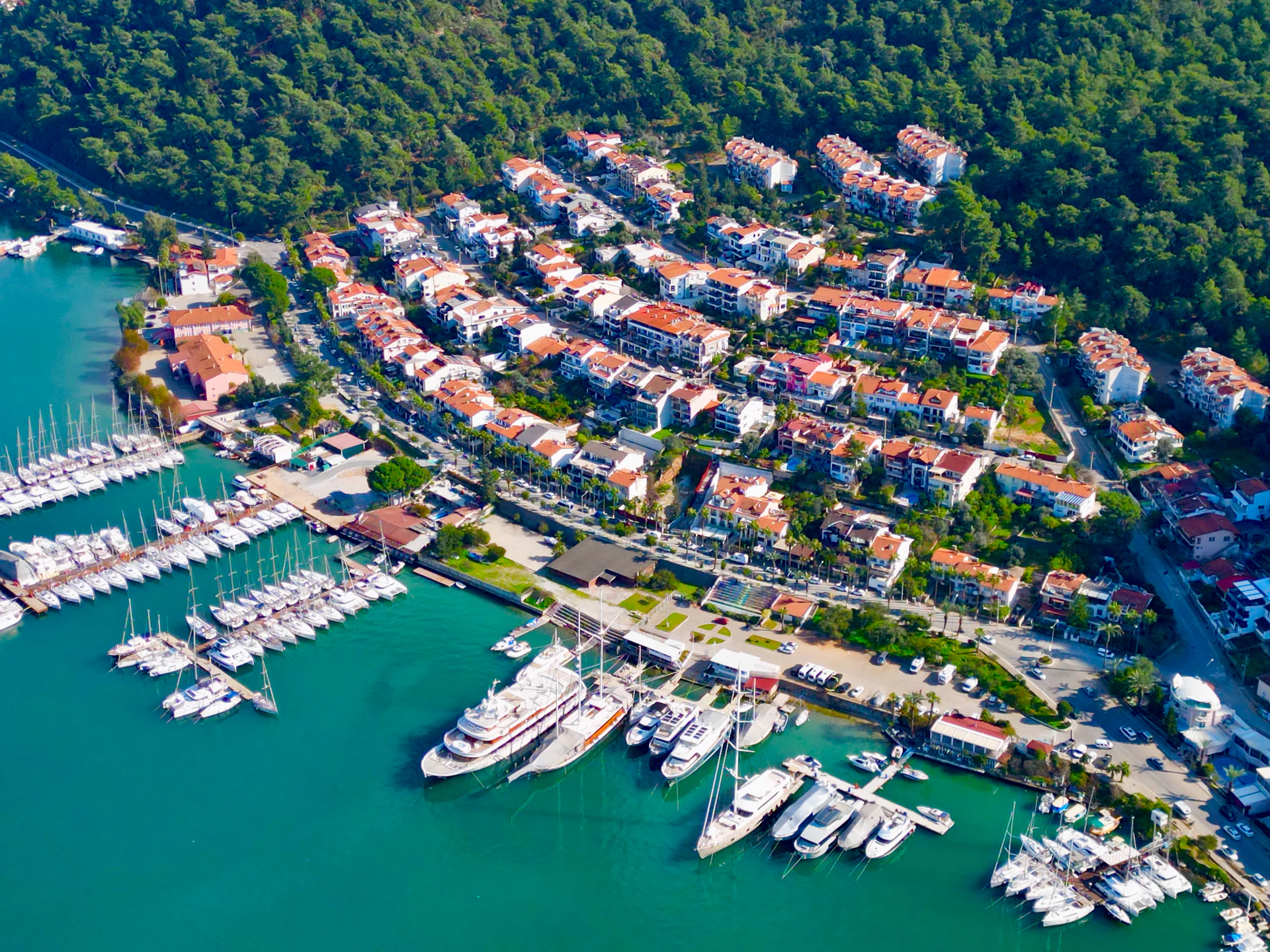 An aerial view of a marina with many boats