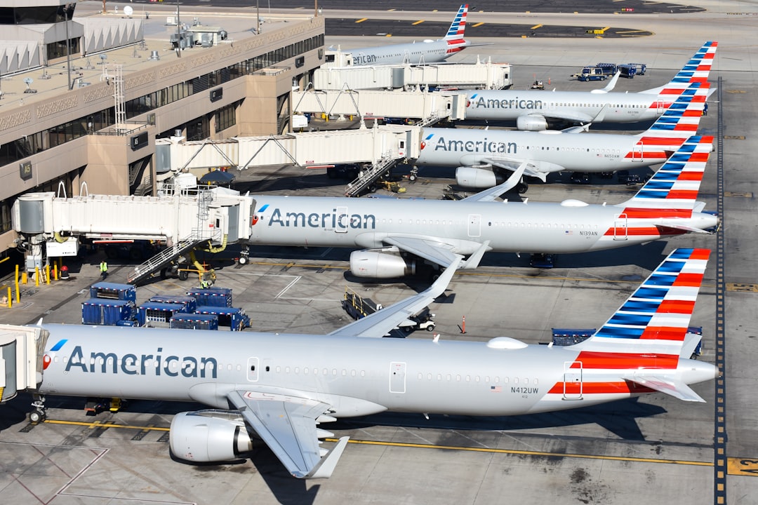 A group of american airlines planes parked at an airport