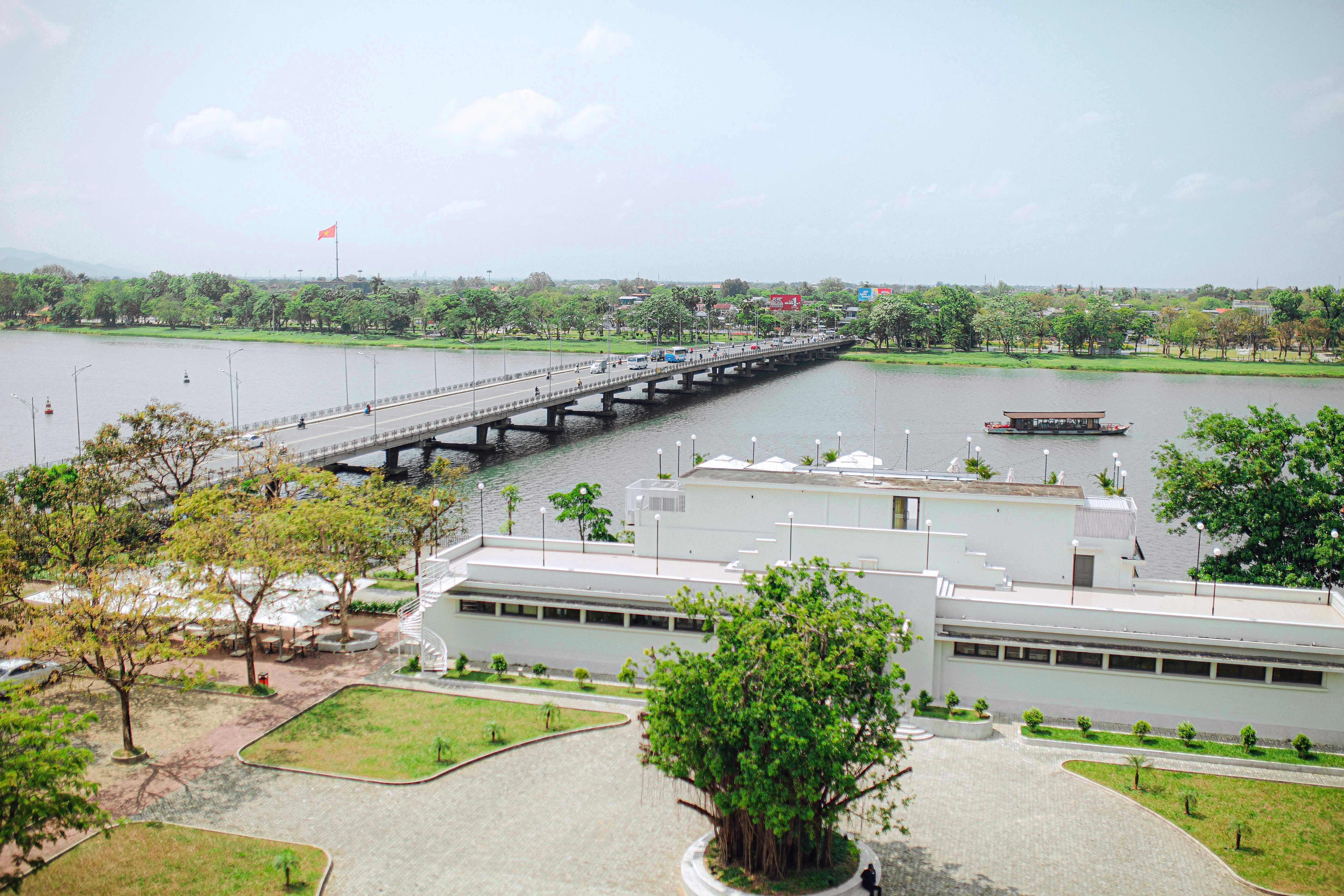 A large body of water with a bridge in the background