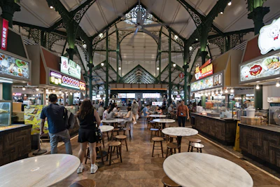 Diners walking through a hawker food centre