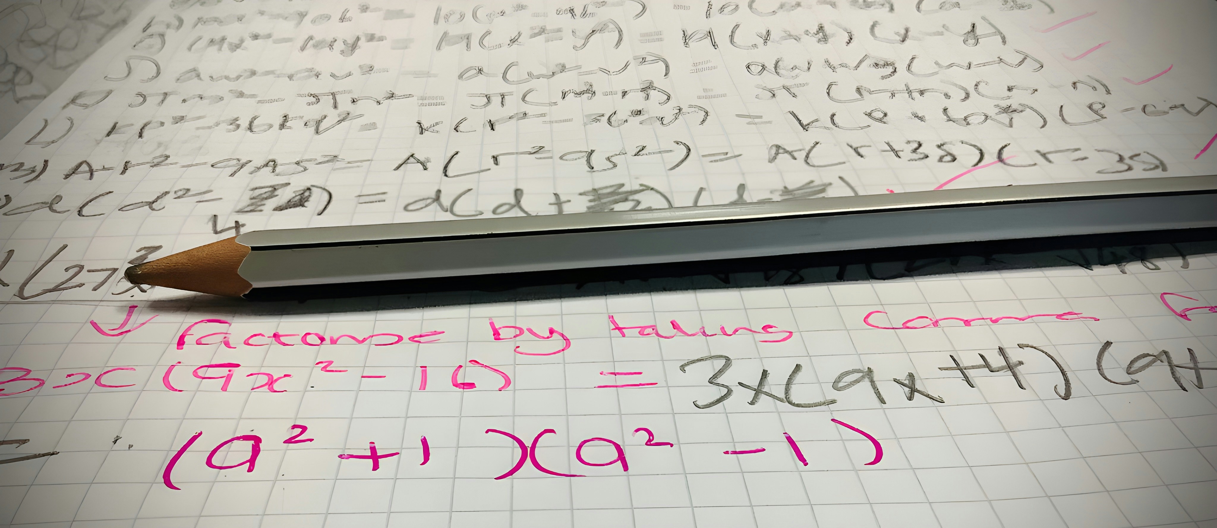 Math homework with a pencil on top