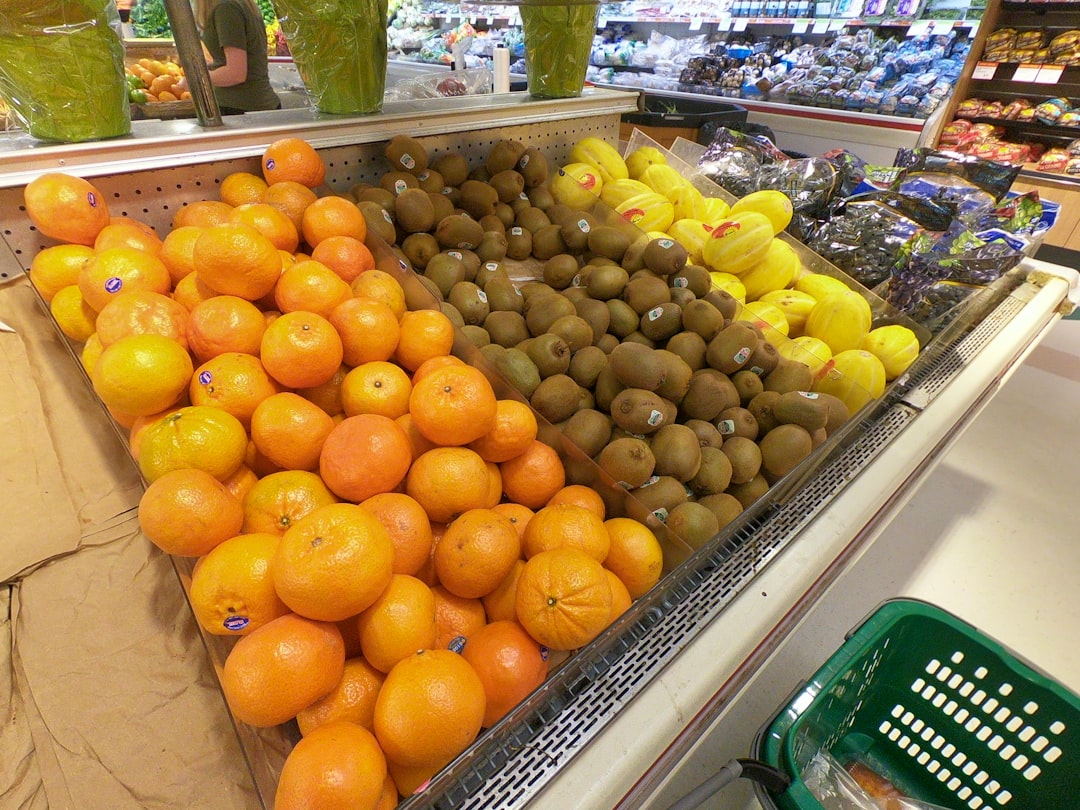 A display in a grocery store filled with lots of fruit,
