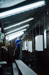 A man in a blue shirt and some lights