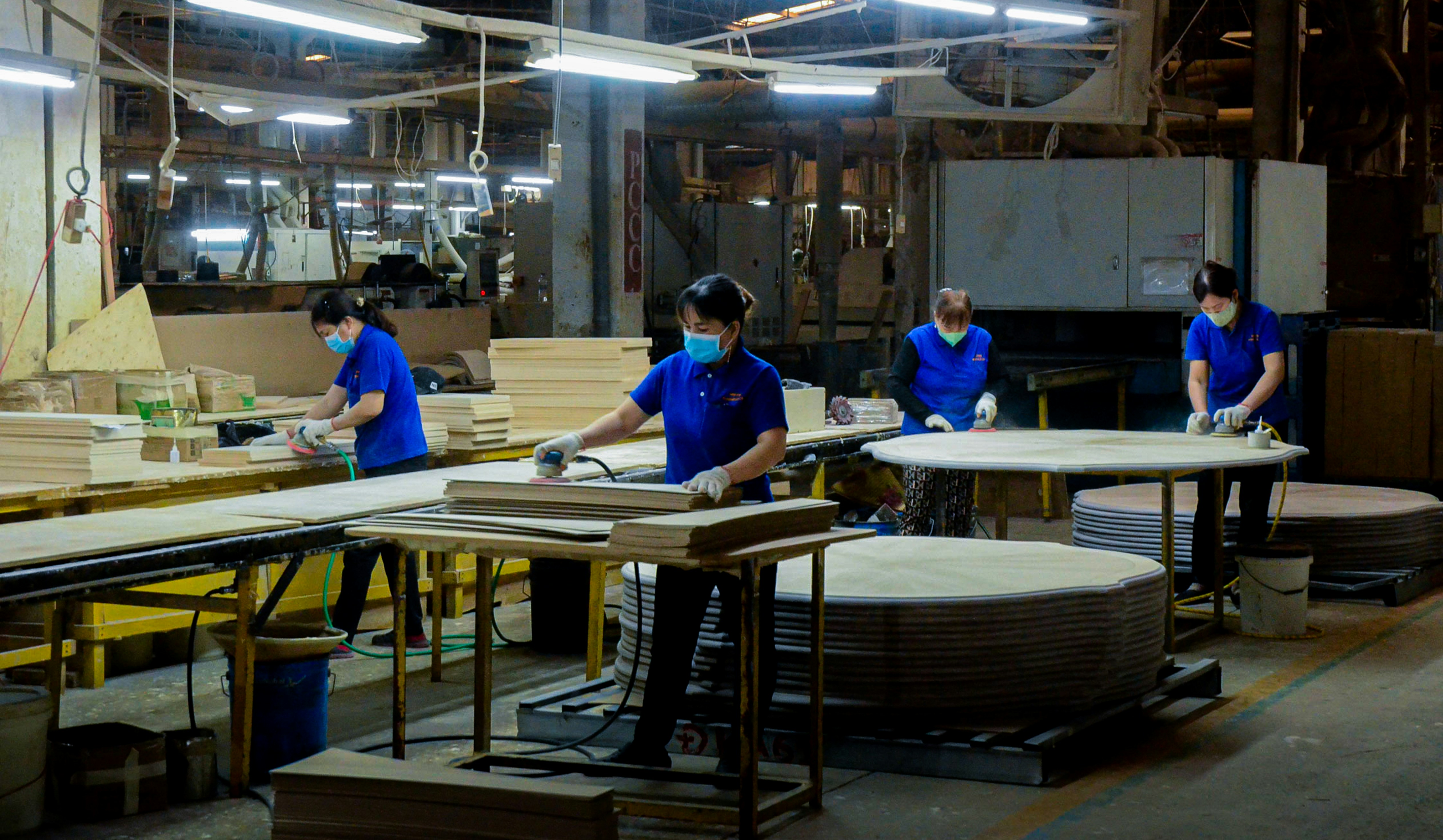 A group of people working in a factory